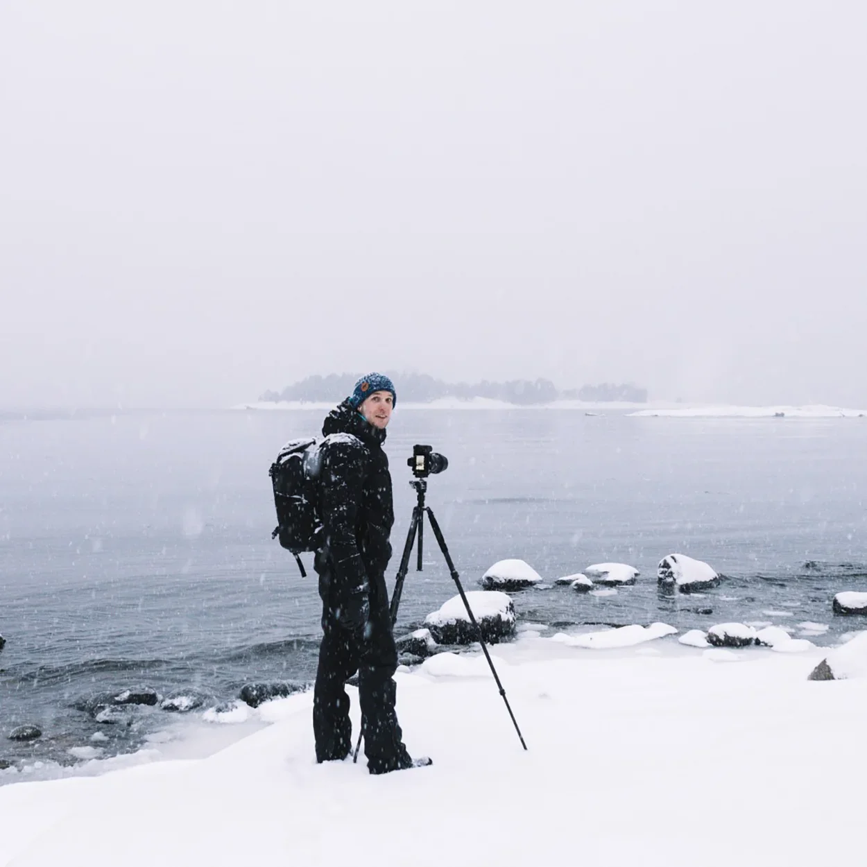 Mikko Lagerstedt photographing a winter landscape outdoors