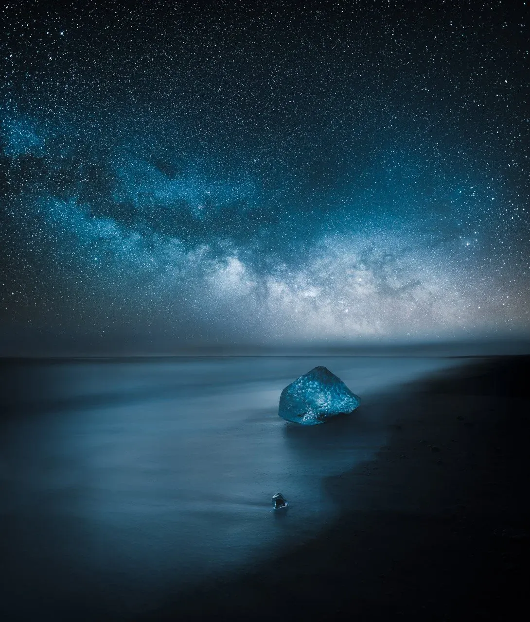 Atmospheric landscape photograph by Mikko Lagerstedt showing a solitary figure in a dark Icelandic scene