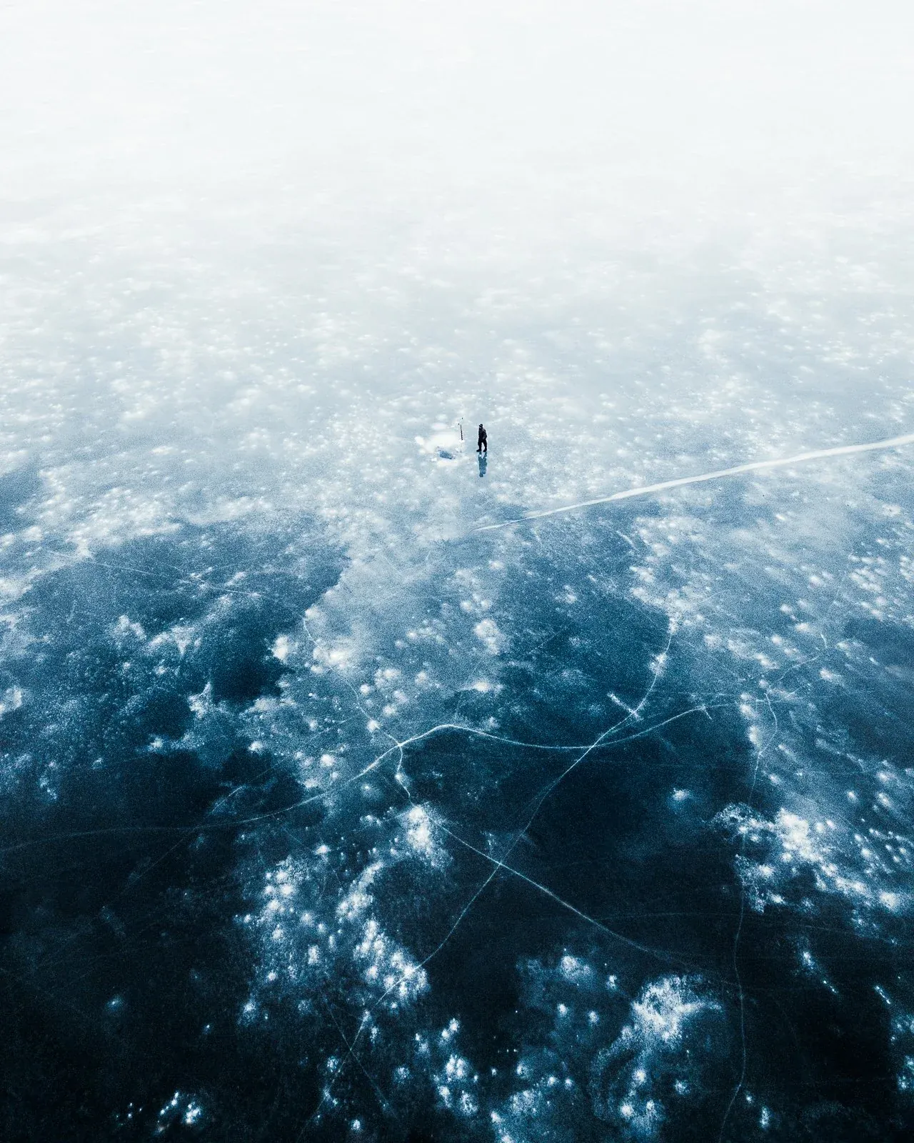 On Thin Ice, a quiet nature photograph from the In The Solitude collection by Mikko Lagerstedt.