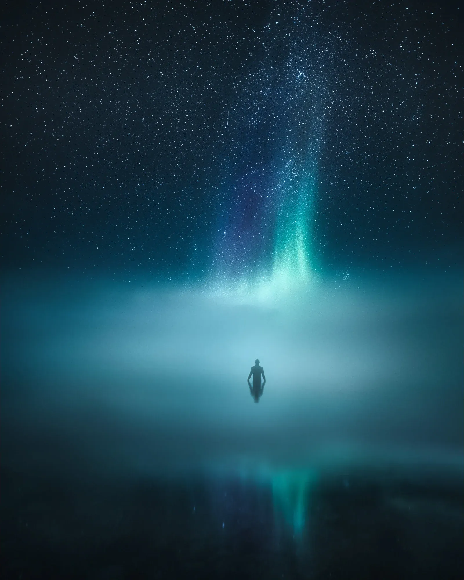 Soft aurora light rising above a quiet northern landscape in Lapland